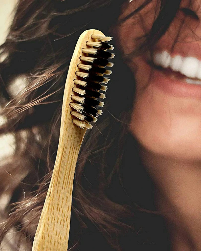 Close-up of a wooden toothbrush with a blurred background