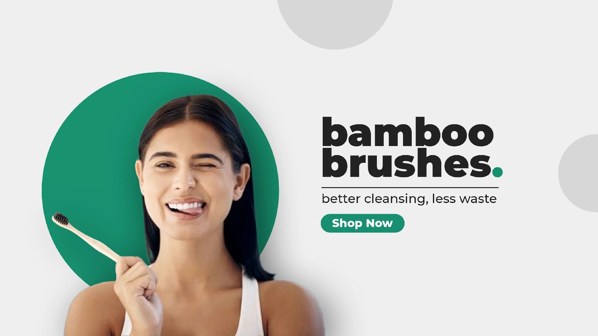 Woman holding a bamboo toothbrush with text: 'Bamboo brushes, better cleansing, less waste. Shop now.